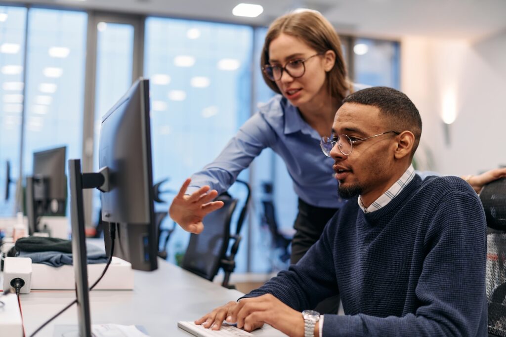 employees discussing outsourced it support